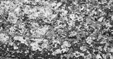 Abstract - close up of old paint texture on tarmac