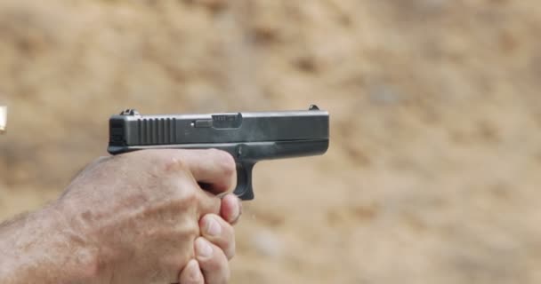 Slow Motion Hand Gun Firing Cartridge Flying Away — Vídeo de Stock