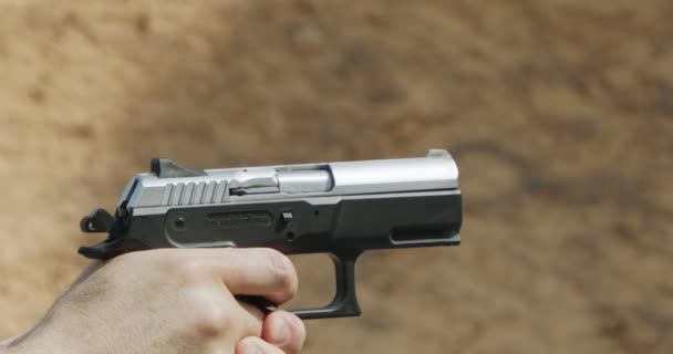 Slow Motion Hand Gun Firing Cartridge Flying Away — Vídeo de Stock
