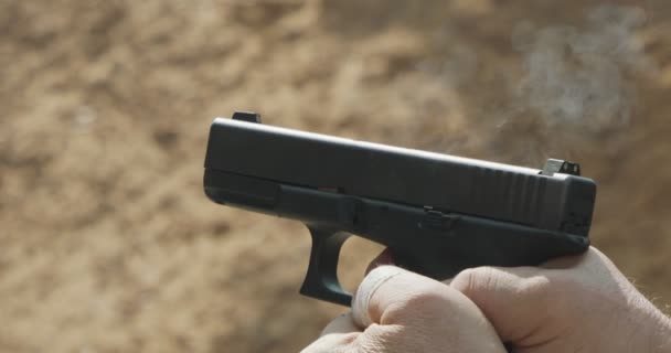Slow Motion Hand Gun Firing Cartridge Flying Away — Stockvideo