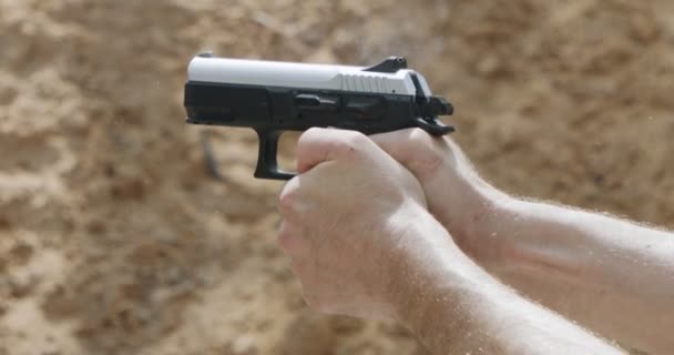 Slow Motion Close Shot Man Shooting Hand Gun While Moving — Vídeo de stock