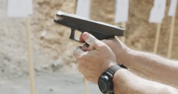 Slow Motion Close Shot Man Shooting Hand Gun While Moving — Stockvideo