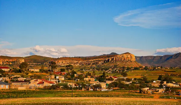 Traditional town in Lesotho with the typical countryside in background — Photo