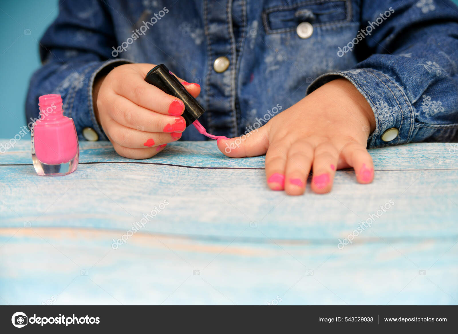 Little Girl Ineptly Paints Her Nails Varnish Her Mother's Cosmetics
