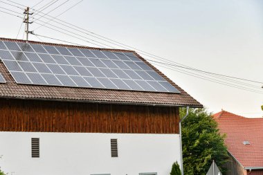 Solar panels on the roof of a private residential building. The concept of ecological electricity.