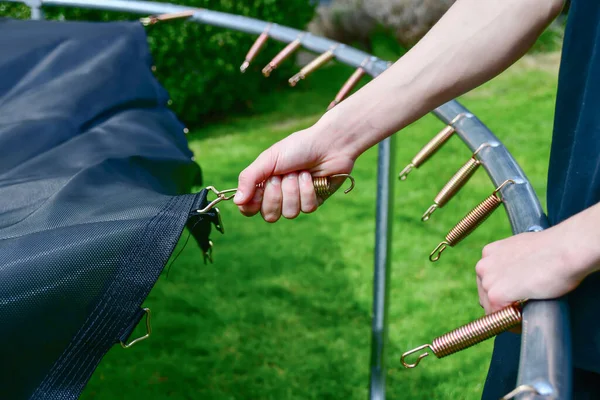 Boy Assembles New Trampoline Stretches Springs Jump — Stock fotografie