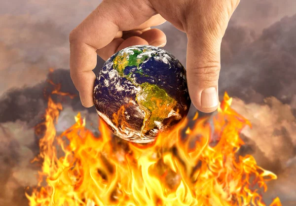 Human Holding Earth Fire Global Warming Concept Stockbild