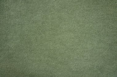 Beyaz arka planda izole edilmiş yeşil kot gömlek. Denim Jacket 'ın yakın çekimi. Denim kot pantolon arka cebinde dikiş var. Sıradan şehir klasiği moda terziliği konsepti.