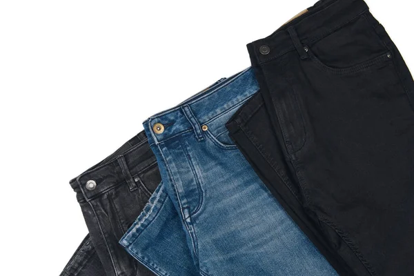Pilha Vários Tons Jeans Azuis Fundo Branco Denim Jeans Textura — Fotografia de Stock