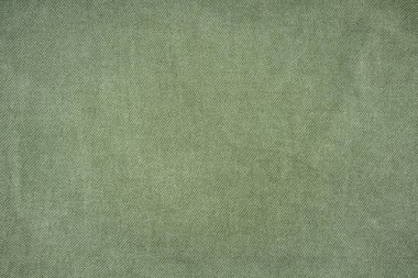Beyaz arka planda izole edilmiş yeşil kot gömlek. Denim Jacket 'ın yakın çekimi. Denim kot pantolon arka cebinde dikiş var. Sıradan şehir klasiği moda terziliği konsepti.