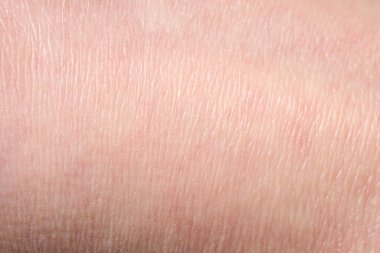 Pembe deri dokusunun arka planı. Sağlıklı cilt. Deri hücrelerinin makro fotoğrafı.