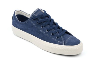 Blue sneakers on a colored background with copy space. Youth shoes. Keds.