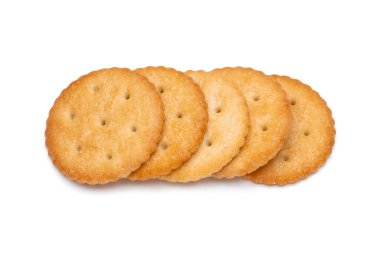 Healthy whole wheat cracker on white background. Stack of Saltine crackers isolated on white background. Round crackers.