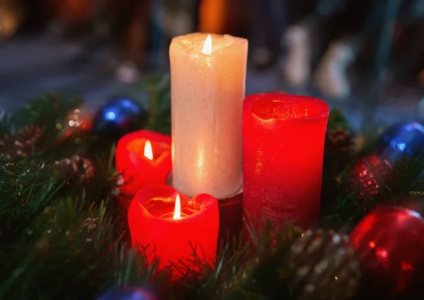 Red advent candles. Christmas decoration with christmas candles burning.