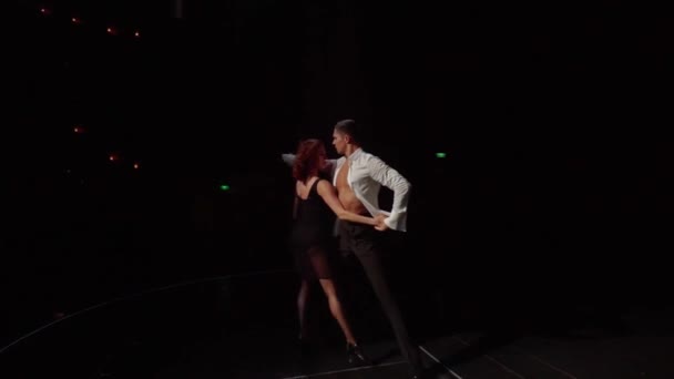 Ballroom Dancers Man Leads Woman Out Darkness Hand Passionately Embraces — Video Stock