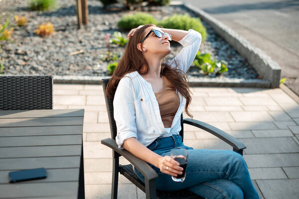 Joyful Caucasian Woman Sunglasses Casual Attire Holding Glass Refreshing Drink Stock Photo