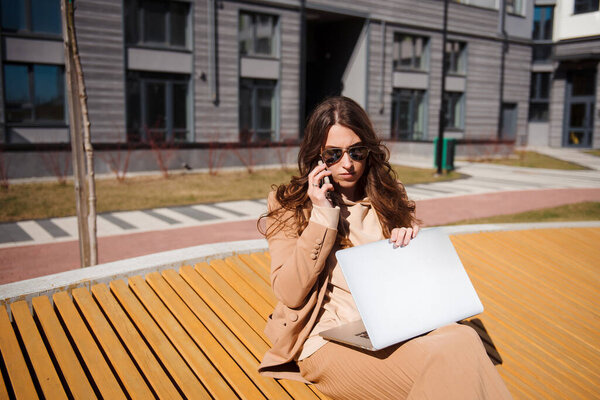 Young Woman Coat Sits Wooden Bench Laptop Outdoors Brunette Talking Stock Photo