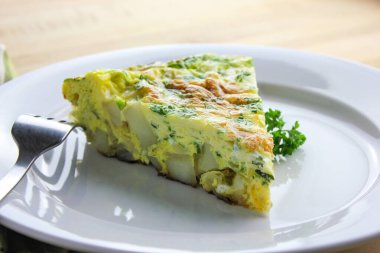 A slice of homemade Frittata Lyonnaise.