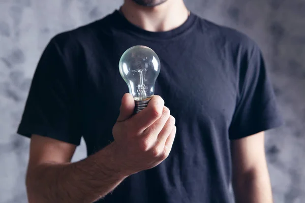 Man Holding Light Bulb — Stock Photo, Image