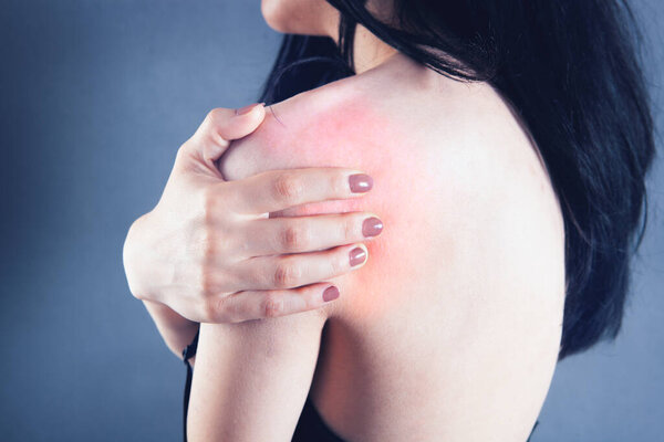 young woman has shoulder pain