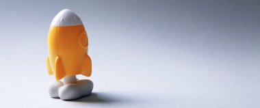 Gri arkaplanda sarı roket