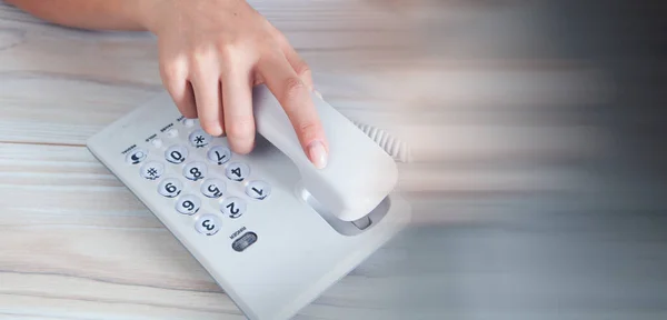 Woman Resetting Home Wired Phone — Stock Photo, Image