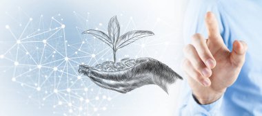 Büyümeyi temsil eden bitkilerle dolu bozuk para yığını