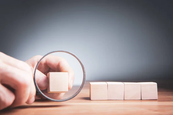 Man Holding Magnifying Glass Wooden Cubes — Stock Photo, Image