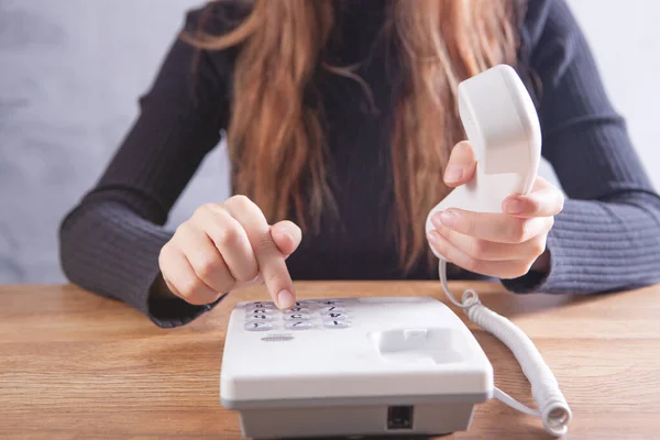 Woman Resetting Home Wired Phone — Stock Photo, Image