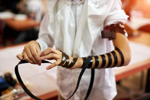 Hand wrap tefilin around the other hand. Jewish teenager 13 years old celebrates bar mitzvah — Stock Photo, Image