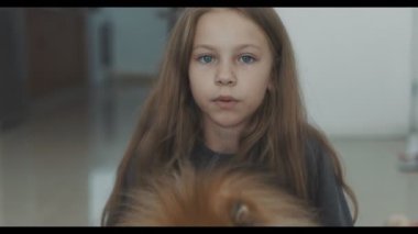 Teen girl hugging her anti depressant, her dog and girl happy and smiling, her doggy helped to overcome depression and believe in herself. Happy girl and her dog friend at home