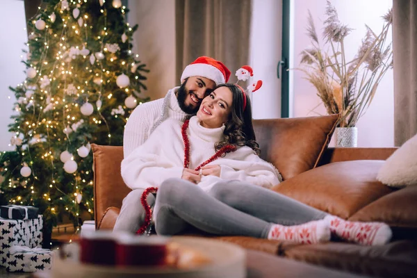 Loving couple celebrates Christmas. — Stock Photo, Image