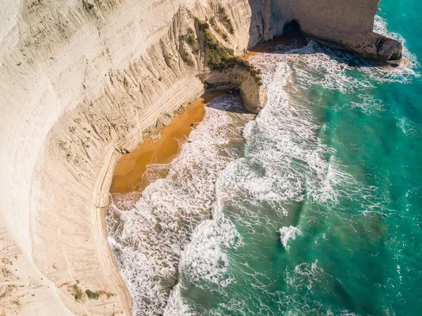 Top down view of deserted shore. Steep coast of Corfu island, Greece.