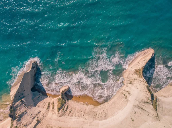 Top down view of deserted shore. Steep coast of Corfu island, Greece.