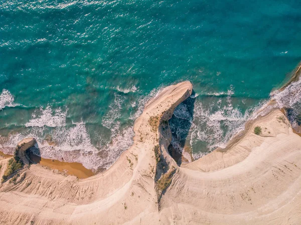 Top down view of deserted shore. Steep coast of Corfu island, Greece.
