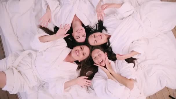 Girlfriends Having Fun Four Young Females Bathrobes Lie Bed Have — Wideo stockowe