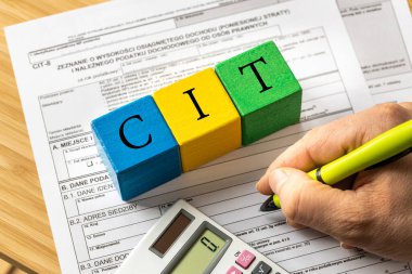 tax settlements for companies in Poland, Forms for business entities, Wooden blocks with the inscription CIT, Tax concept for enterprises  clipart