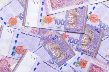 dağınık Malezya para banknotları 100 ringgit, iş ekonomisi geçmişi 