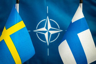 16, May 2022, The flags of Sweden and Finland against the background of the symbol of the NATO defense alliance, The concept of the willingness of two Scandinavian countries to join the ranks of the North Atlantic Pact