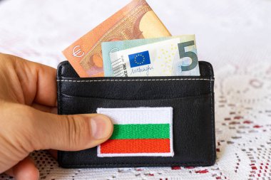 Wallet with protruding euro banknotes and the symbol of Bulgaria, The concept of currency change and Bulgaria's willingness to join the Euro zone