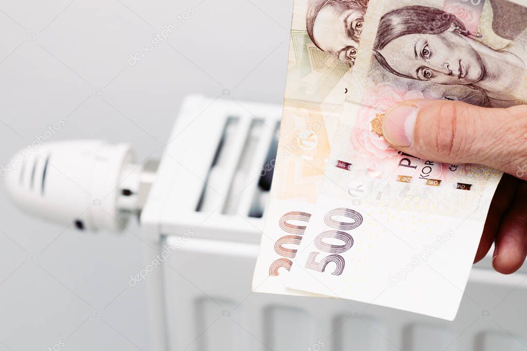 Home heating prices, Increase in energy prices in the Czech Republic, Heater and Czech crowns in your hand