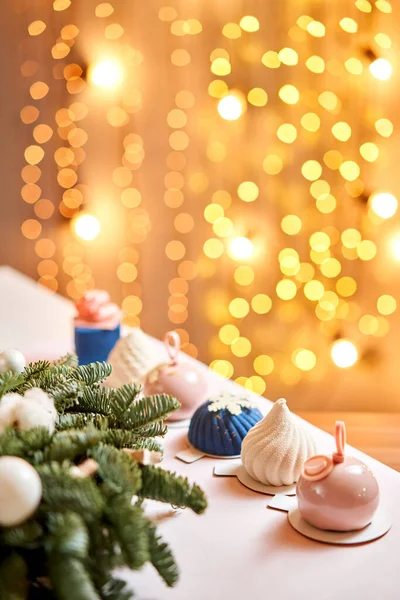 Merry Christmas card. Variety of sweet delicious cakes. Fir branches on a gray background. Merry Christmas card. New year mood — Stock Photo, Image