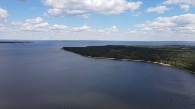 Photo of the Dnieper River from flight altitude, drone shooting. Forest next to the river 