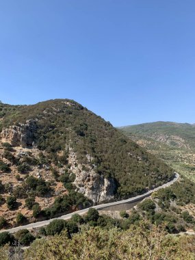 Rocks and road near the town of Agios Nikolaos Crete, Greece. . High quality photo