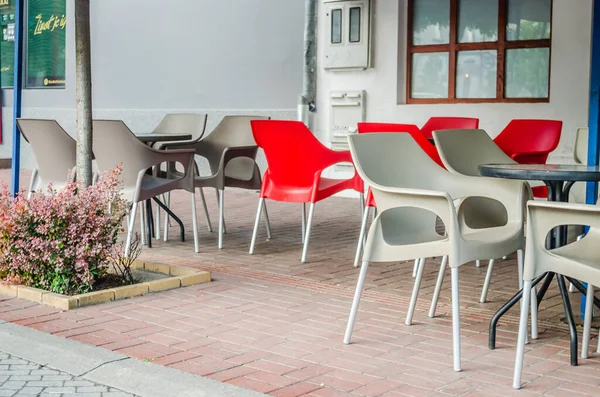 Srbobran is a town in Serbia. A panoramic view of the main street in the town of Srbobran. Novi Sad, Serbia. Plastic chairs in a local restaurant in Srbobran.