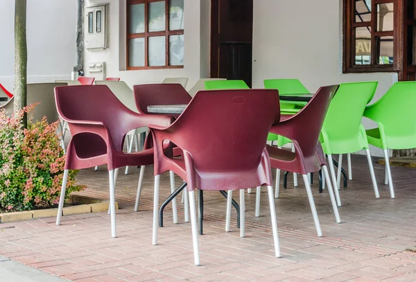 Srbobran is a town in Serbia. A panoramic view of the main street in the town of Srbobran. Novi Sad, Serbia. Plastic chairs in a local restaurant in Srbobran.