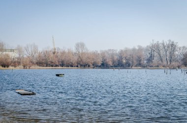 Panoramic view of the Danube river delta in winter. A view of the Danube river delta in winter and the forgotten boats in the water.