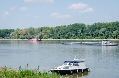 Tugboat on the Danube River. Tugboat passing by moored tankers on the Danube River.