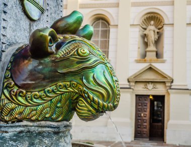 Pecs, Hungary - October 06, 2018: Cityscape on main city Square of Pecs - Hungary. Zsolnay fountain landmark Pecs. Zsolnay manufactured sculptures on a fountain in the main square in Pecs Hungary