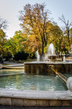 Pecs, Hungary - October 06, 2018: The fountain in the city park Pecs, Hungary, in the fall.